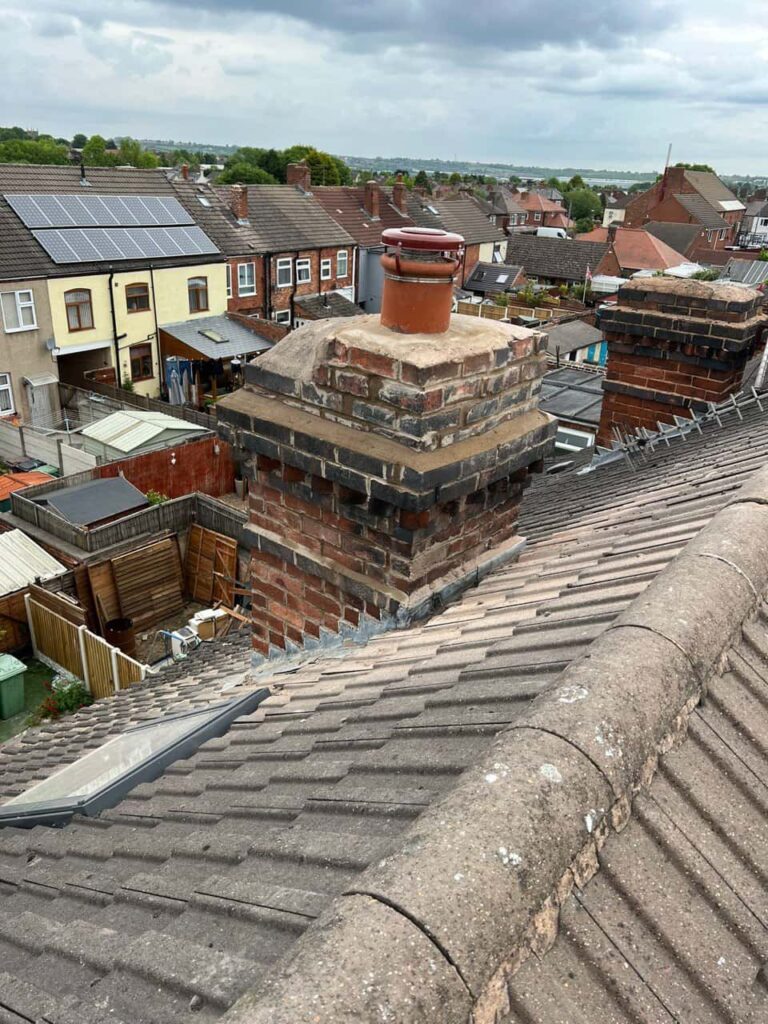 This is a photo taken from a roof which is being repaired by Brownsover Roofing Repairs, it shows a street of houses, and their roofs